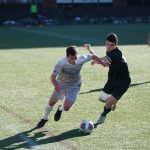 man playing soccer on the field