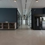 architectural photography of black and brown hallway