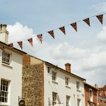 Buildings decorated with uk flag bunting.