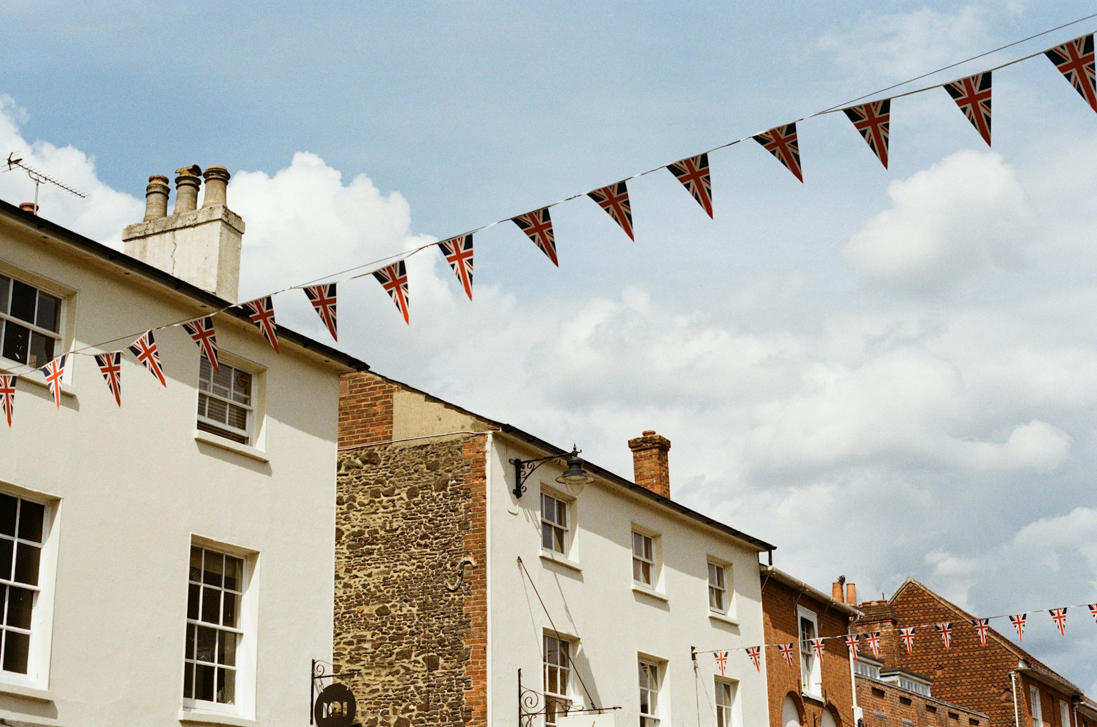 Buildings decorated with uk flag bunting.